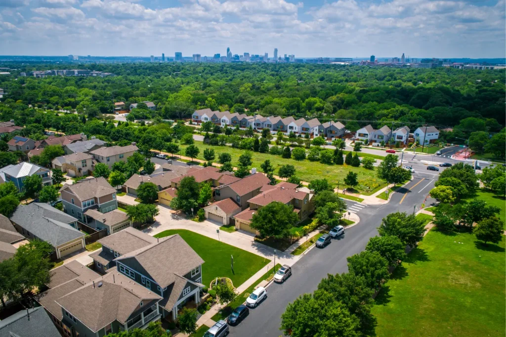 local addiction treatment depicting a suburban community with tree-lined streets and distant city skyline.