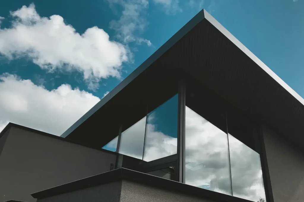 treatment center featuring a modern building with sharp angles and reflective glass windows