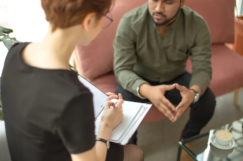 Opiate treatment center consultation between a counselor and patient in a comfortable, private setting.